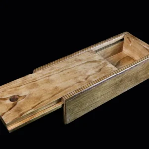 A wooden box with a sliding lid on top of it.