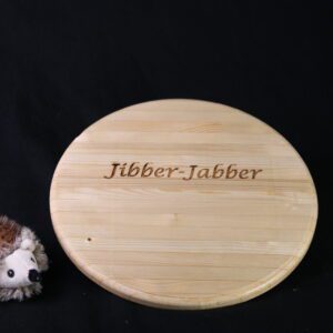 A wooden plate with the words " jibber-jabber ".